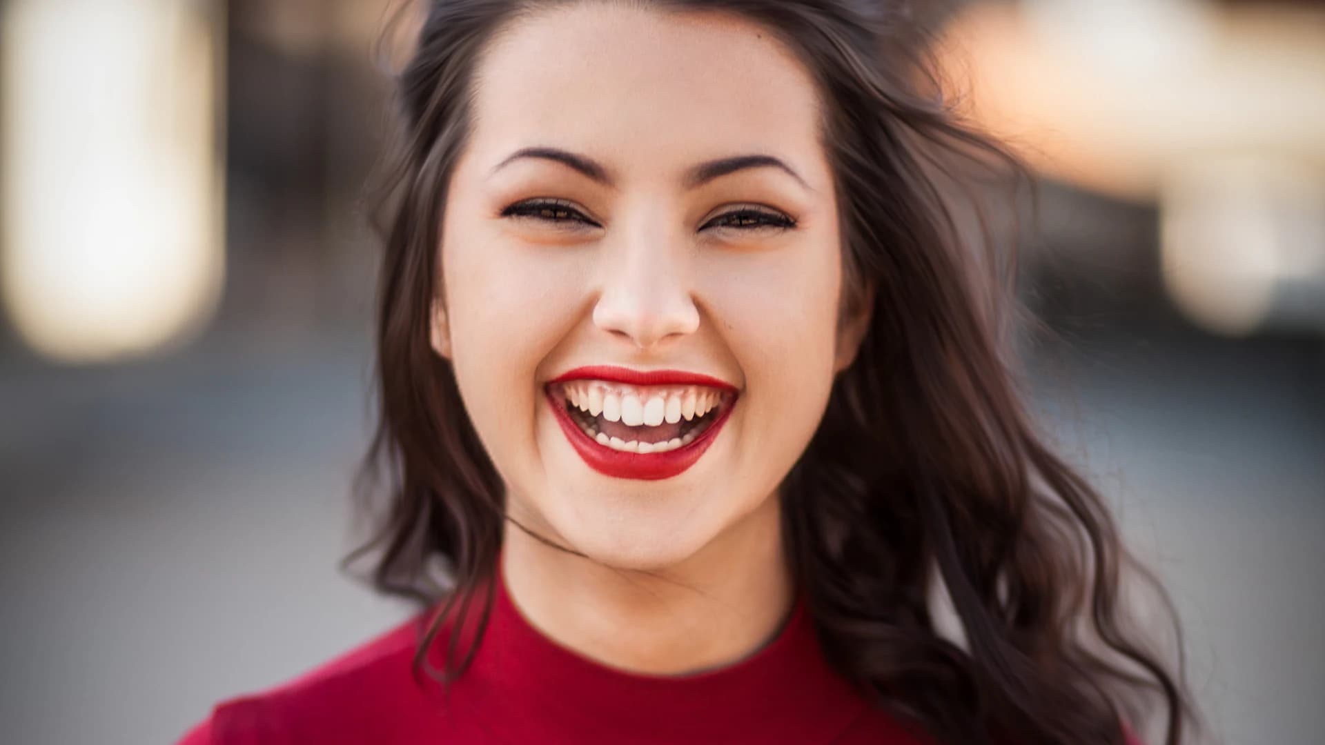 A woman smiling warmly
